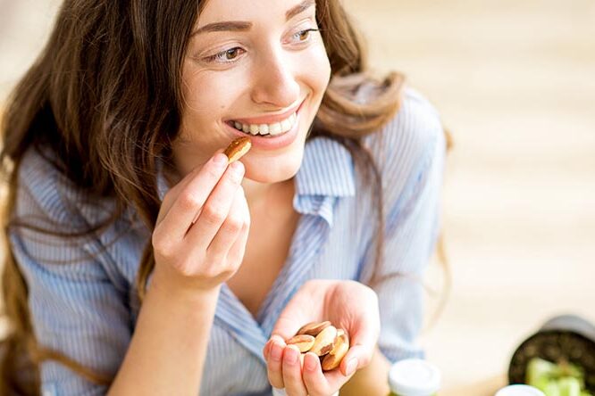 Woman eating nuts
